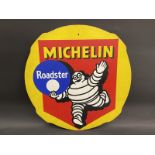 A Michelin 'Roadster' pictorial hardboard advertising garage sign, 24 1/2" diameter.