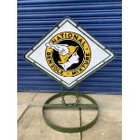 A lozenge shaped garage forecourt sign advertising National Benzole on a 'petrified' chain, a