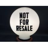 A 'Not For Resale' pill shaped glass petrol pump globe by Hailware, one chip to neck otherwise good.