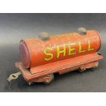 A Hornby O gauge tinplate model railway tanker bearing Shell and BP advertising.
