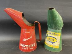 A Havoline Motor Oil quart measure dated August 1952 and a Duckhams 20-50 quart measure.