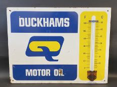 A Duckhams Motor Oil enamel thermometer sign by Burnham of London, 26 x 20".