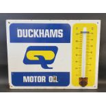 A Duckhams Motor Oil enamel thermometer sign by Burnham of London, 26 x 20".