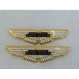 Two David Brown Aston Martin car badges.