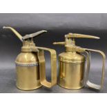 A good quality polished brass Enots oiler and one other.