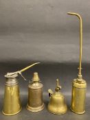 A good quality polished brass oiler stamped 'Suisse' and three others.