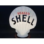 A reproduction Sealed Shell glass petrol pump globe, good condition.