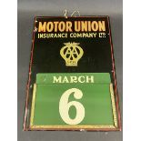 A Motor Union Insurance Company Ltd tin fronted calendar with a full set of month and day metal