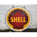 A pair of Shell circular enamel signs, by Bruton of London, mounted back to back in a bronze hanging