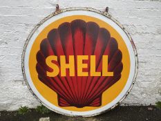 A pair of Shell circular enamel signs, by Bruton of London, mounted back to back in a bronze hanging
