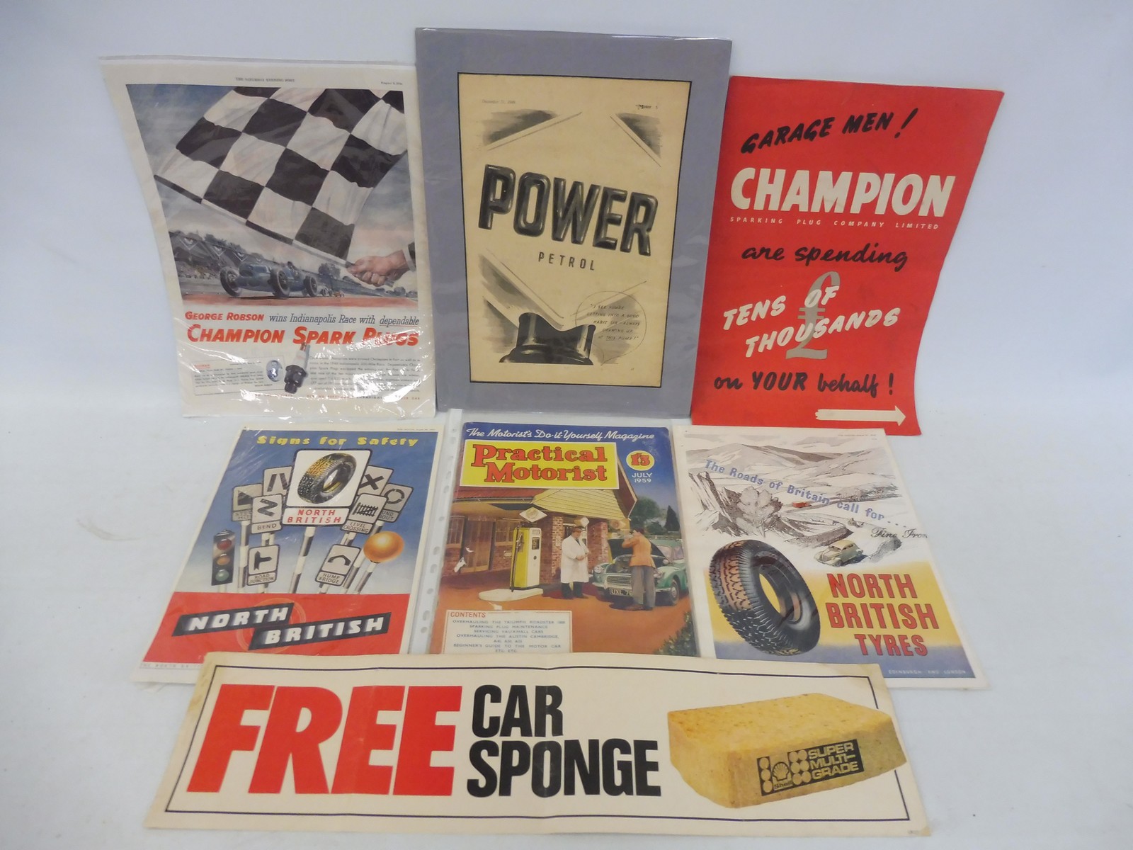 A collection of assorted ephemera and advertising including a booklet for Champion spark plugs etc.