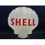 A Shell glass petrol pump globe by Hailware, chip to neck otherwise very good condition, fully