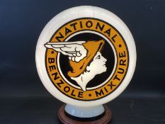 A reproduction National Benzole Mixture three sided glass petrol pump globe.