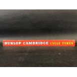 A Dunlop Cambridge Cycle Tyres shelf strip.