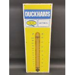 A Duckhams 20-50 Motor Oil enamel thermometer sign by Burnham of London, 13 x 36".