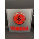 A Yamaha illuminated garage forecourt lightbox.