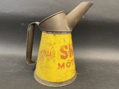 A Shell Motor Oil quart measure, dated 1948.