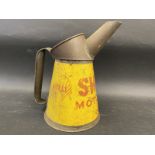 A Shell Motor Oil quart measure, dated 1948.