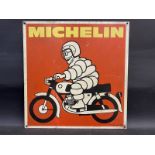 A Michelin pictorial aluminium advertising sign depicting Mr. Bibendum on a motorcycle, 17 1/2 x