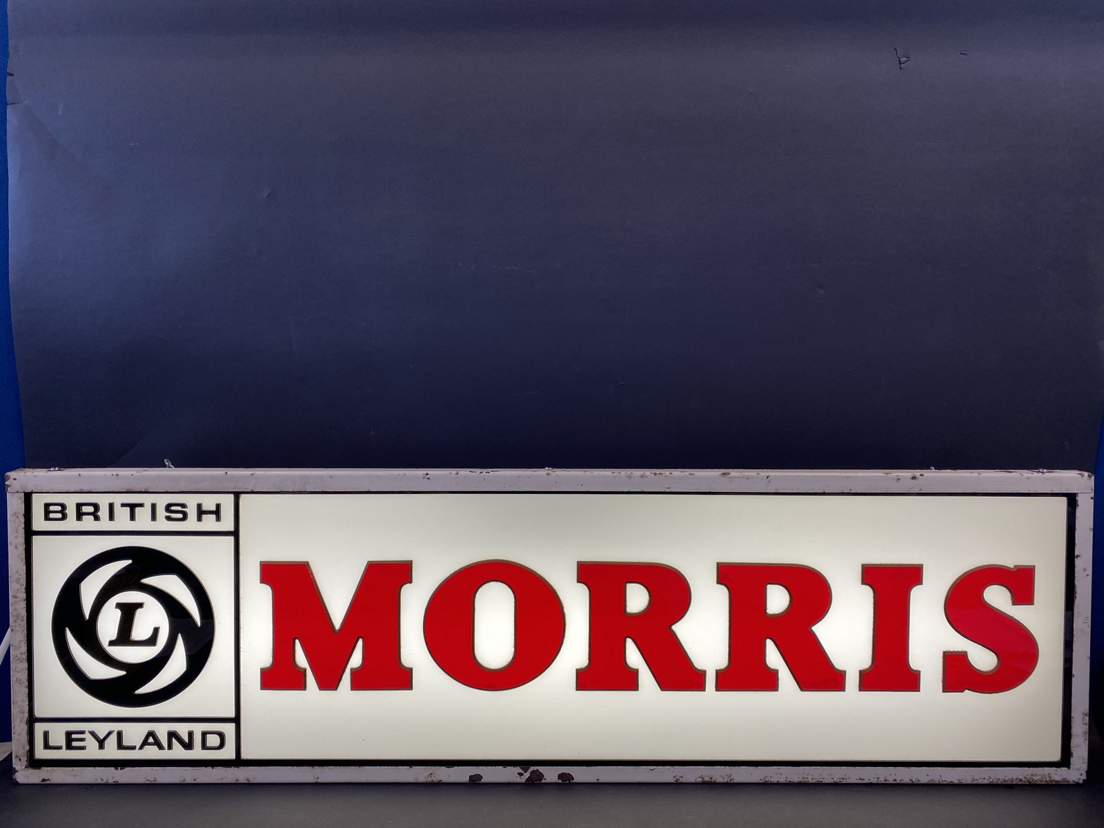 A British Leyland Morris illuminated lightbox, 48" w x 14" h x 5" d.