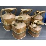 A set of five copper and brass mounted weights and measures canisters by Gaskell & Chambers,