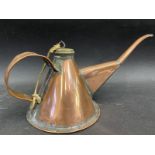 A good quality polished copper oiler.