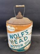 A Wolf's Head Motor Oil can.