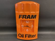 A Fram Oil Filter garage showroom advertising wall clock, 15 1/2 x 24".