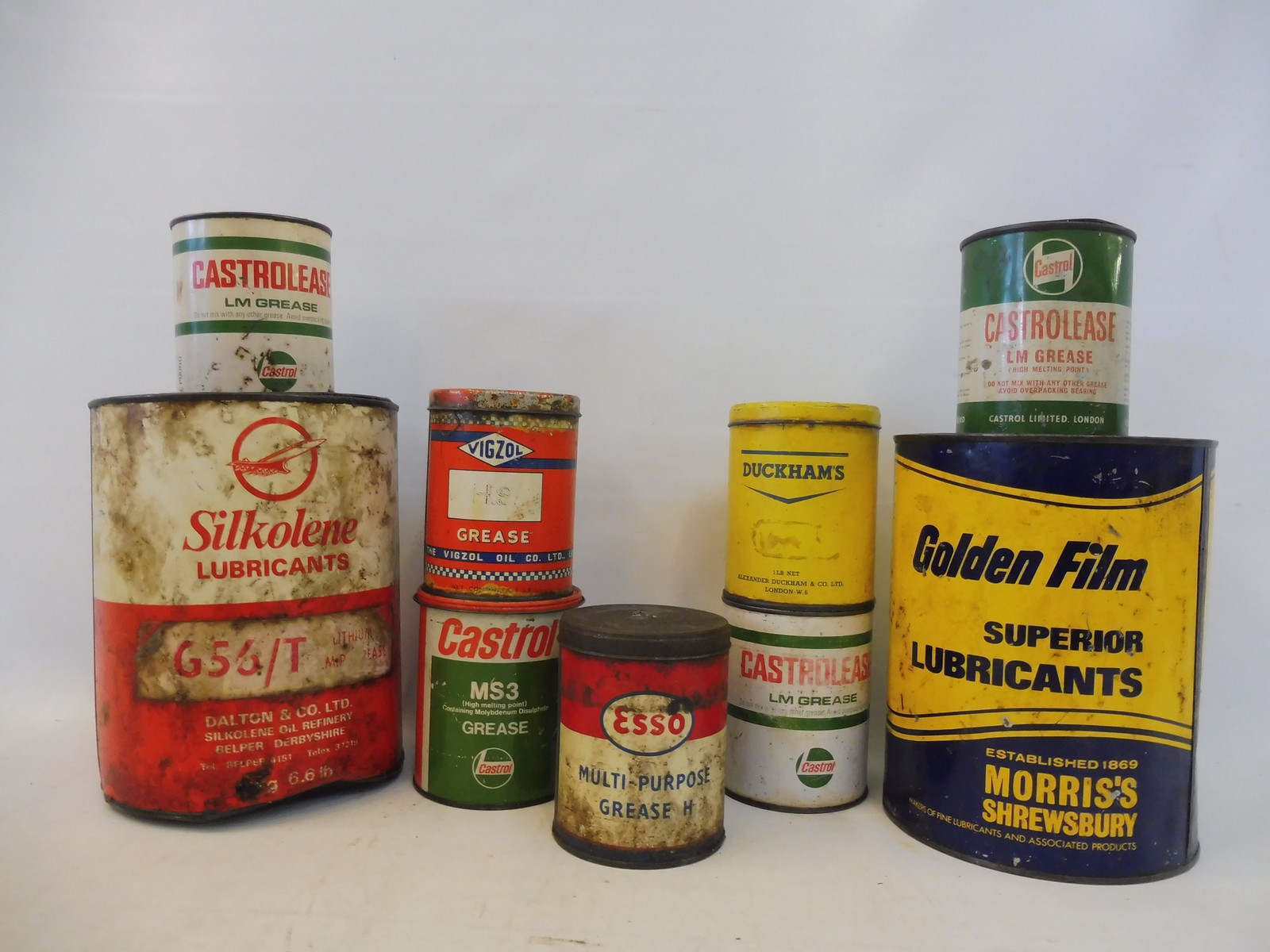 A Morris's of Shrewsbury 7lb grease tin, one other and seven 1lb grease tins including Castrolease