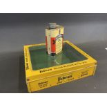 A Fibrax Brake Blocks counter top dispensing tin with glass lid and a Raleigh Industries tin, both