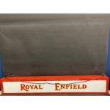 A decorative illuminated lightbox with applied decals for Royal Enfield, 52 1/2 x 8".
