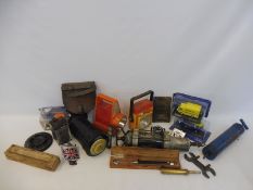 A quantity of garage equipment to include a UCL gun, a glass motorcycle battery etc.