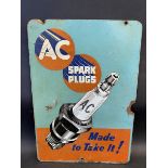 An AC Spark Plugs pictorial hardboard advertising sign, 10 1/4 x 15".