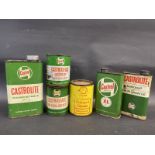 Three Castrol oil cans and three grease tins.