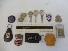 A Ford Main Dealer Burgess & Garfield of Yardley enamel badge plus a selection of keyrings and