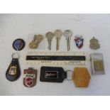 A Ford Main Dealer Burgess & Garfield of Yardley enamel badge plus a selection of keyrings and