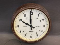 A bakelite wall clock, bearing the words to the dial 'Lucas Bulbs', repaired by Bright's of London.