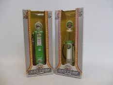 Two cased replica 'gas pumps'.