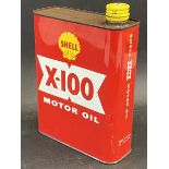 A red Shell X-100 Motor Oil can.