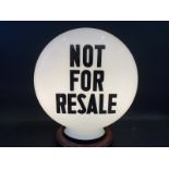 A 'Not For Resale' glass pill shaped petrol pump globe by Hailware, large chip to neck, otherwise