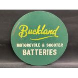 A Buckland Motorcycle & Scooter Batteries circular hardboard advertising sign, 14" diameter.