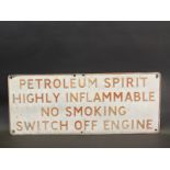 A 'Petroleum Spirit Highly Flammable...' embossed aluminium garage forecourt sign, 32 x 13".