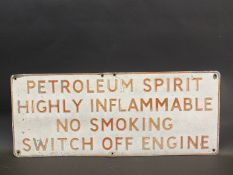 A 'Petroleum Spirit Highly Flammable...' embossed aluminium garage forecourt sign, 32 x 13".