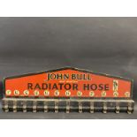 A John Bull Radiator Hose wall mounted rack, 31 1/2 x 11".