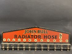 A John Bull Radiator Hose wall mounted rack, 31 1/2 x 11".