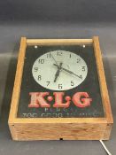 A Smiths Sectric KLG advertising clock, housed in a case for display.