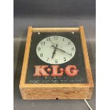 A Smiths Sectric KLG advertising clock, housed in a case for display.