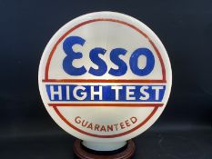 A rare and early Esso High Test Guaranteed glass petrol pump globe in very good condition, fully