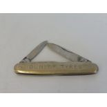 A Dunlop Tyres penknife marked to the reverse: Burns Philp (Southsea) Co. Ltd.