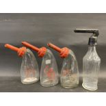 Two Lucas battery filler glass bottles and two others.